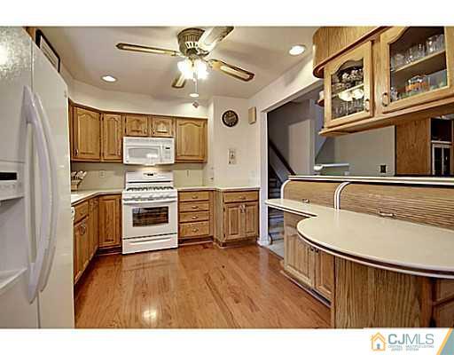 8 June Way Middlesex, NJ 08846 - Photo 8 of 25 a kitchen with stainless steel appliances a stove a sink and a refrigerator