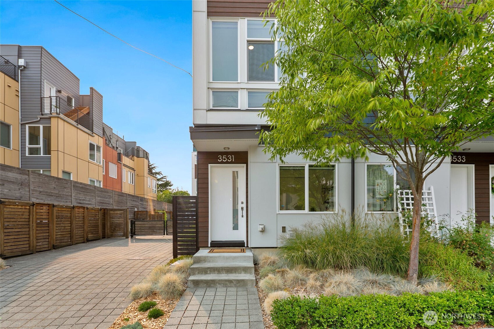 a front view of a house with garden