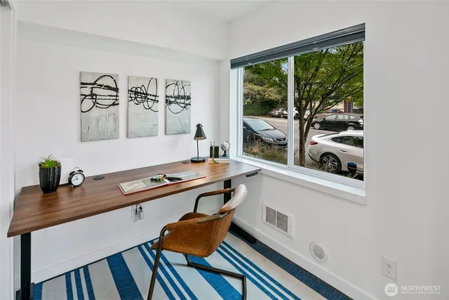 a room with a desk and a window