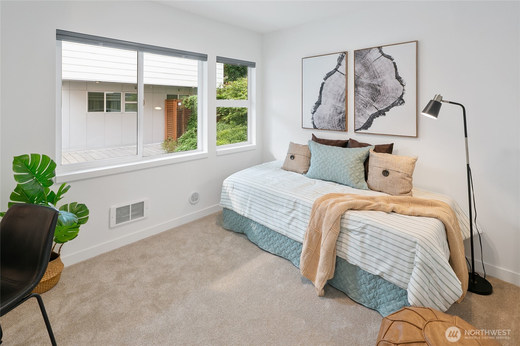 3531 Wallingford Avenue North Seattle, WA 98103 - Photo 23 of 33 a bedroom with a bed and a window
