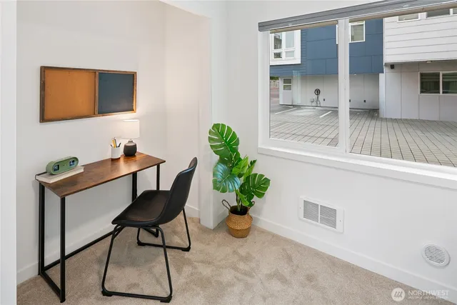 a room with furniture and a potted plant