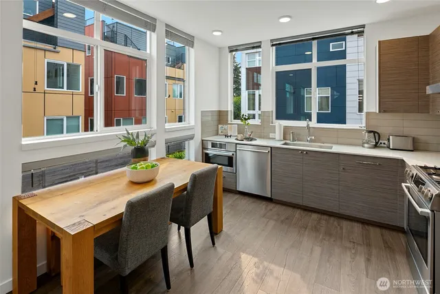a kitchen with a stove a sink and a refrigerator