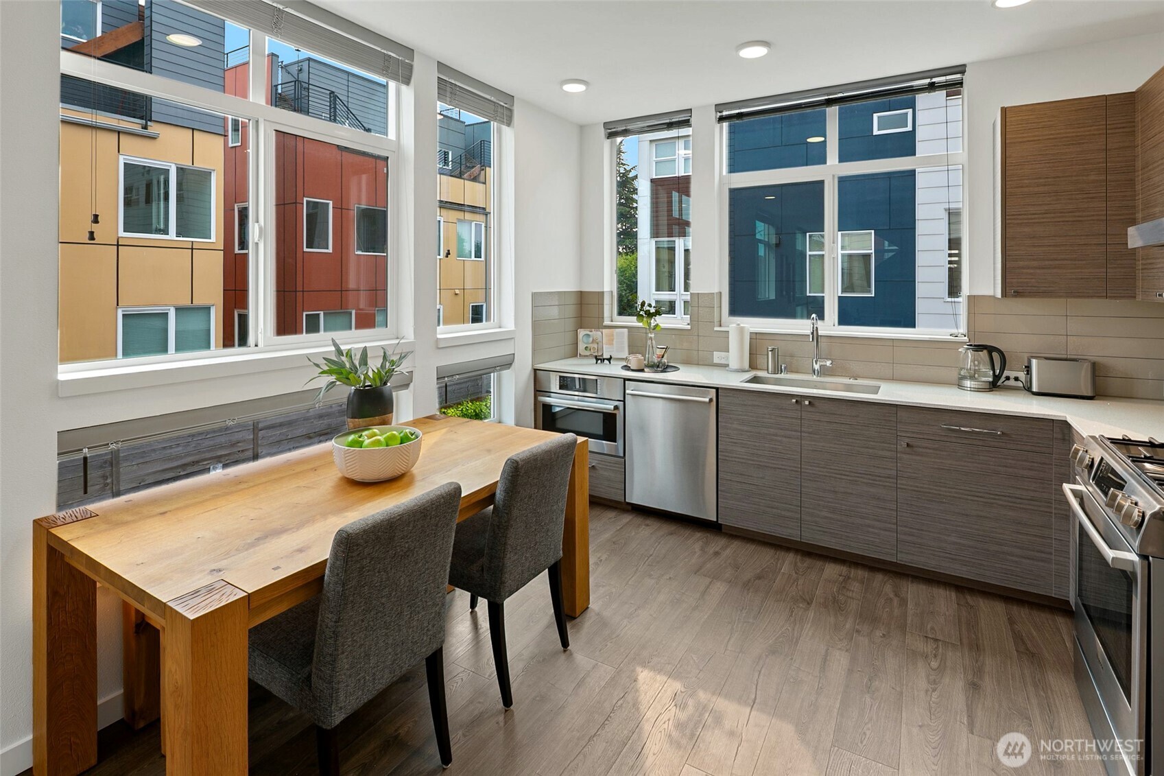 3531 Wallingford Avenue North Seattle, WA 98103 - Photo 8 of 33 a kitchen with a stove a sink and a refrigerator