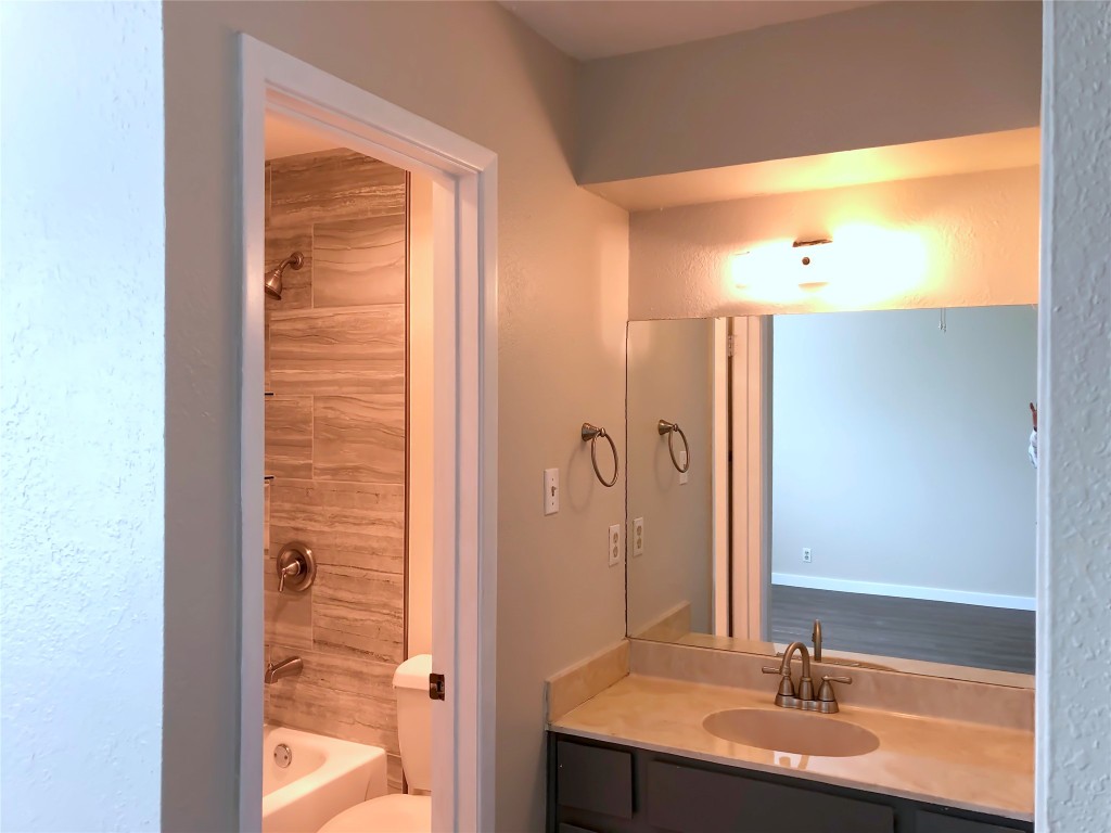 1915 Magazine Street Austin, TX 78727 - Photo 15 of 18 a bathroom with a bathtub and a sink