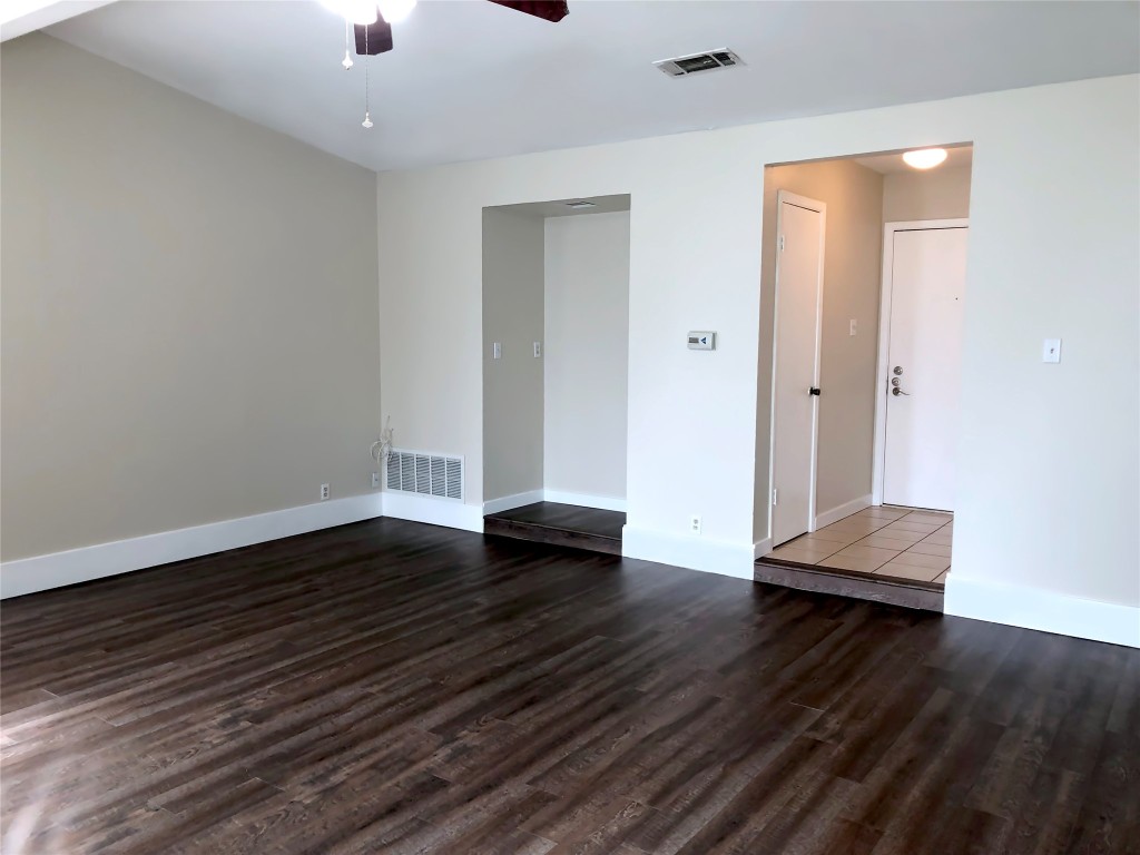 1915 Magazine Street Austin, TX 78727 - Photo 5 of 18 an empty room with wooden floor and windows
