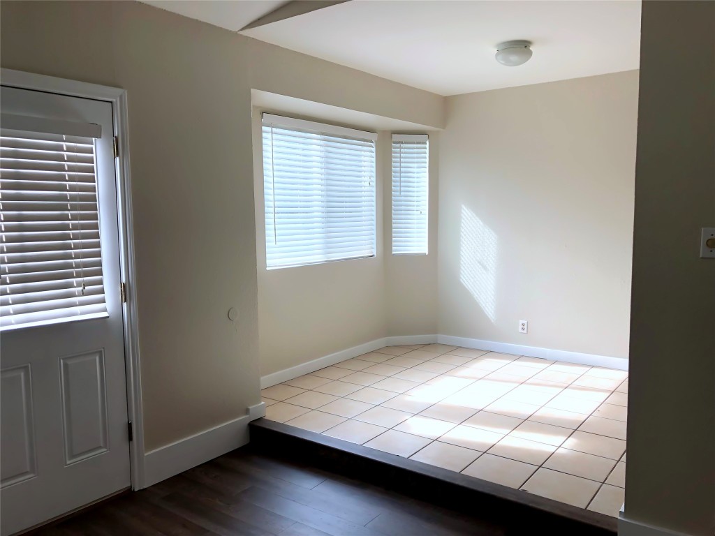 1915 Magazine Street Austin, TX 78727 - Photo 9 of 18 a bedroom with a bed and a window