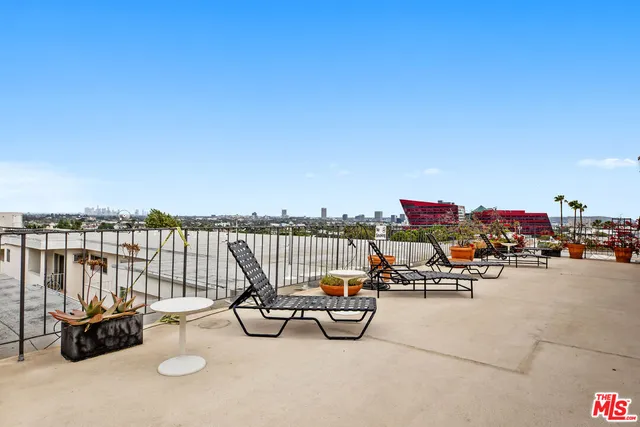 a view of a terrace with chairs