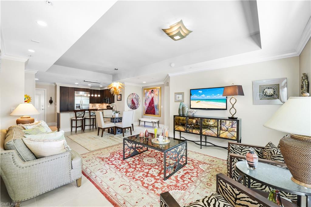 9115 Strada Place, Unit 5314 Naples, FL 34108 - Photo 11 of 49 a living room with furniture and wooden floor