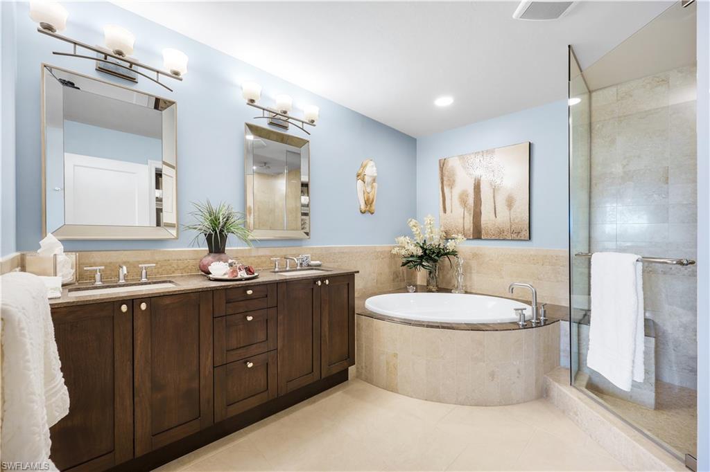 9115 Strada Place, Unit 5314 Naples, FL 34108 - Photo 15 of 49 a bathroom with a double vanity sink mirror and toilet