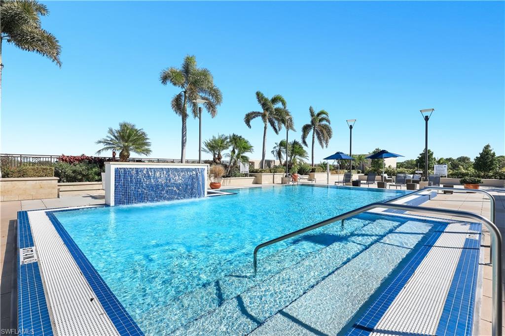 9115 Strada Place, Unit 5314 Naples, FL 34108 - Photo 30 of 49 a view of swimming pool with outdoor seating