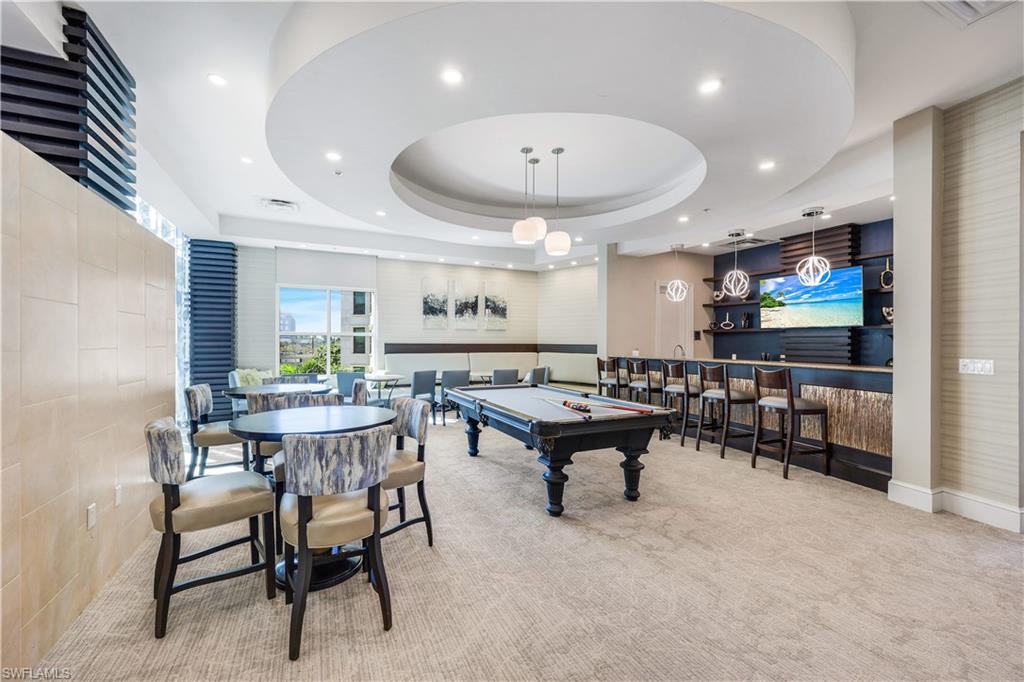 9115 Strada Place, Unit 5314 Naples, FL 34108 - Photo 33 of 49 a living room with furniture and a wooden floor