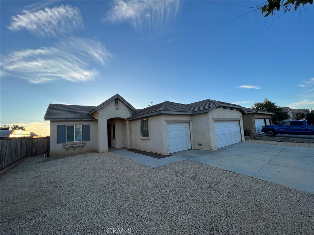 9011 Azalea Springs Road Oak Hills, CA 92344 - Photo 1 of 1 a view of a house with a yard