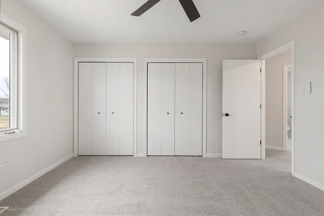 a bathroom with a sink mirror and toilet
