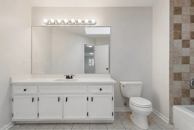 a bathroom with a bathtub and a toilet