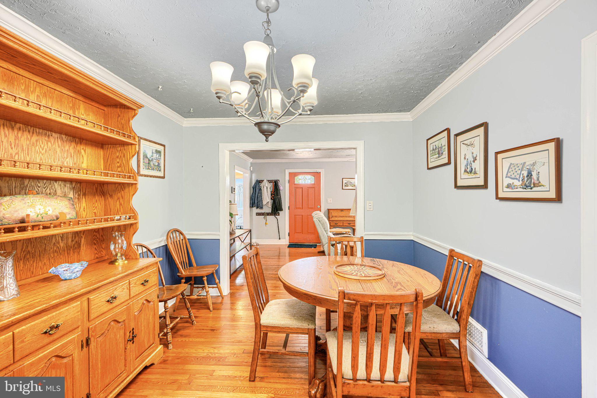 1234 St Andrews Way Baltimore, MD 21239 - Photo 21 of 38 a view of a dining room with furniture and chandelier