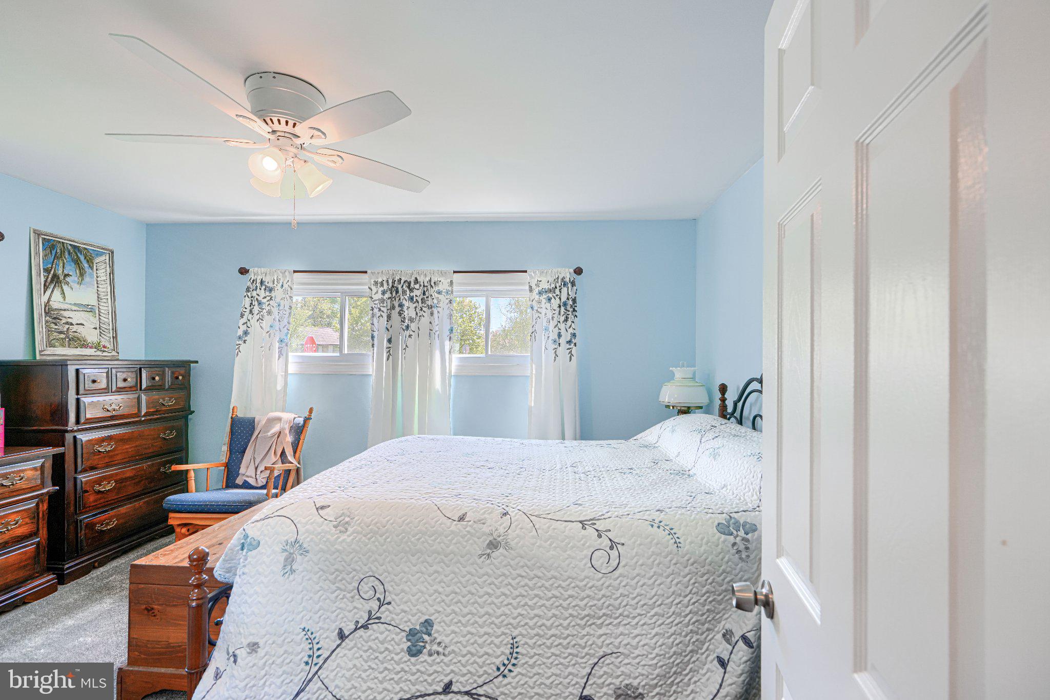 1234 St Andrews Way Baltimore, MD 21239 - Photo 34 of 38 a bedroom with a bed and wooden floor