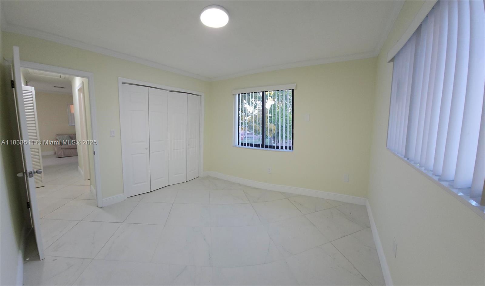 46 Northwest 35th Street, Unit 2 Miami, FL 33127 - Photo 3 of 21 an empty room with windows