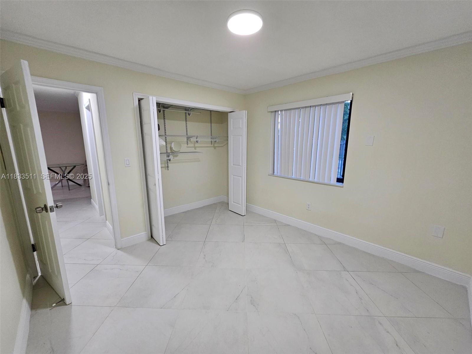 46 Northwest 35th Street, Unit 2 Miami, FL 33127 - Photo 5 of 21 an empty room with closet
