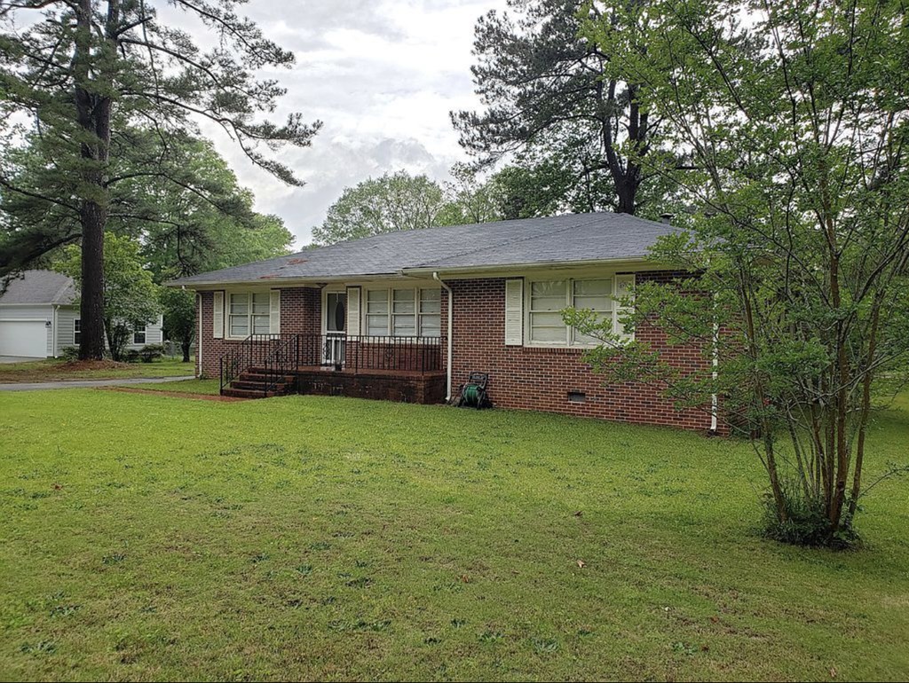 209 Teel Road West Point, GA 31833 - Photo 2 of 22 Yard in spring/summer
