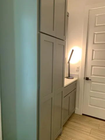 a bathroom with a sink and mirror