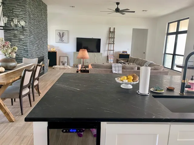 a living room with furniture and flat screen tv