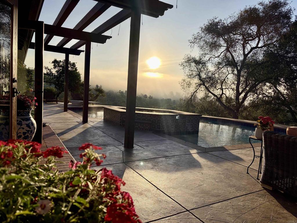 707 Live Oak Park Road South Fallbrook, CA 92028 - Photo 1 of 59 a view of a chairs and tables in the patio next to a yard
