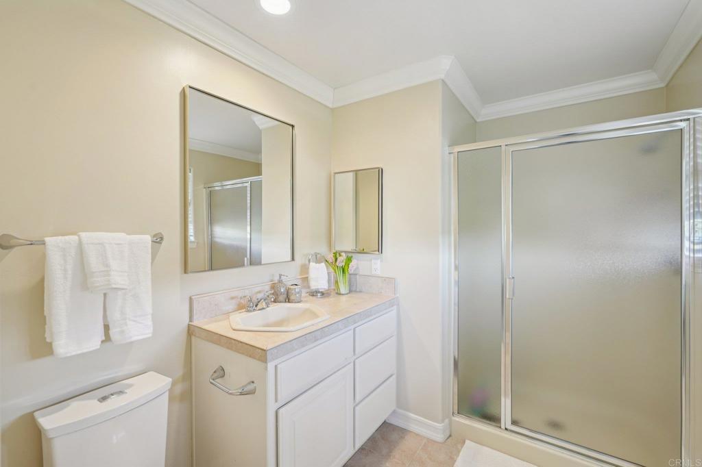 707 Live Oak Park Road South Fallbrook, CA 92028 - Photo 31 of 59 a bathroom with a sink mirror vanity and toilet