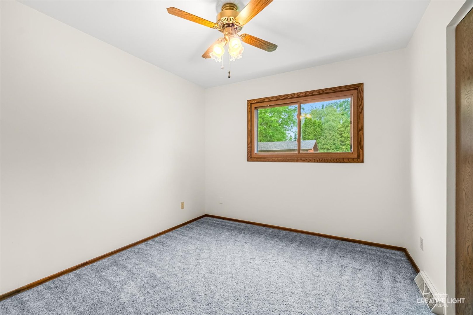 1483 Nova Road Sandwich, IL 60548 - Photo 15 of 29 an empty room with a window and a fan