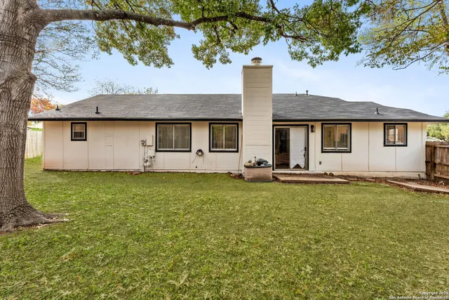 a house view with swimming pool in front of it