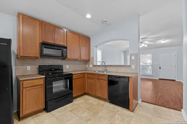 a large kitchen with cabinets