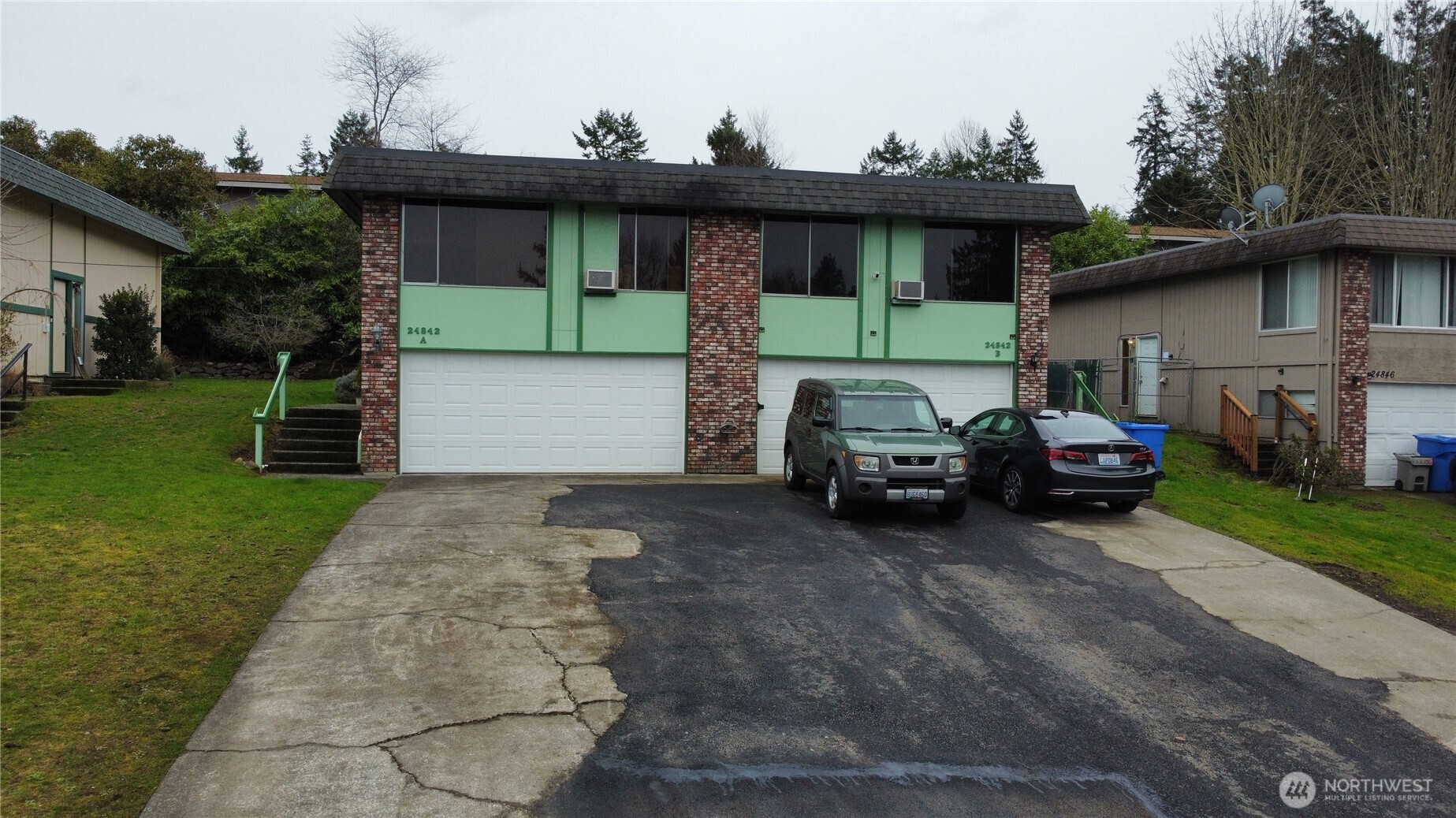 a view of a car parked in front of a house