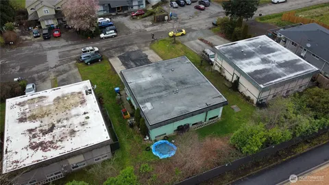 an aerial view of a house with a backyard