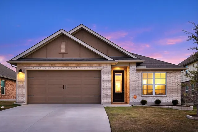a front view of a house with outdoor space