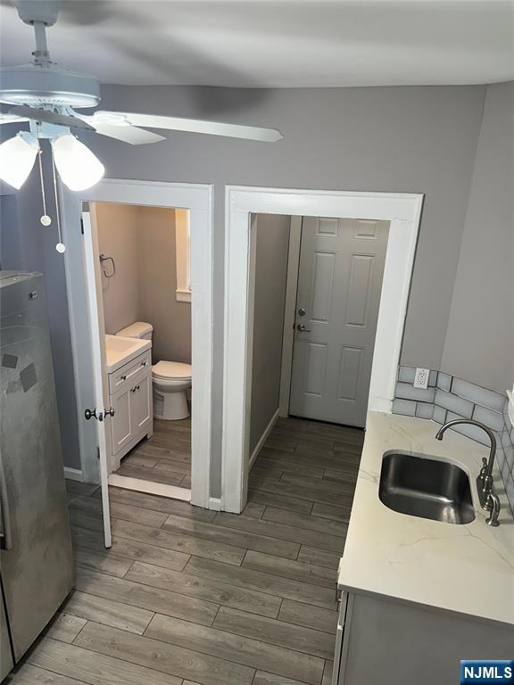 1041 Hunterdon Street Newark, NJ 07112 - Photo 8 of 25 a bathroom with a sink and a washing machine