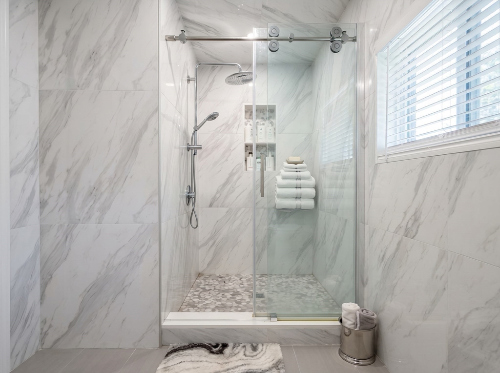 115 Hawthorn Road Braintree, MA 02184 - Photo 14 of 37 a bathroom with a shower and a toilet