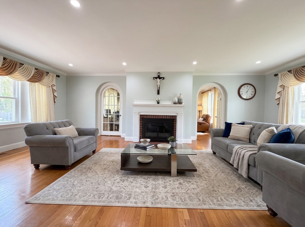 115 Hawthorn Road Braintree, MA 02184 - Photo 5 of 37 a living room with furniture and a fireplace