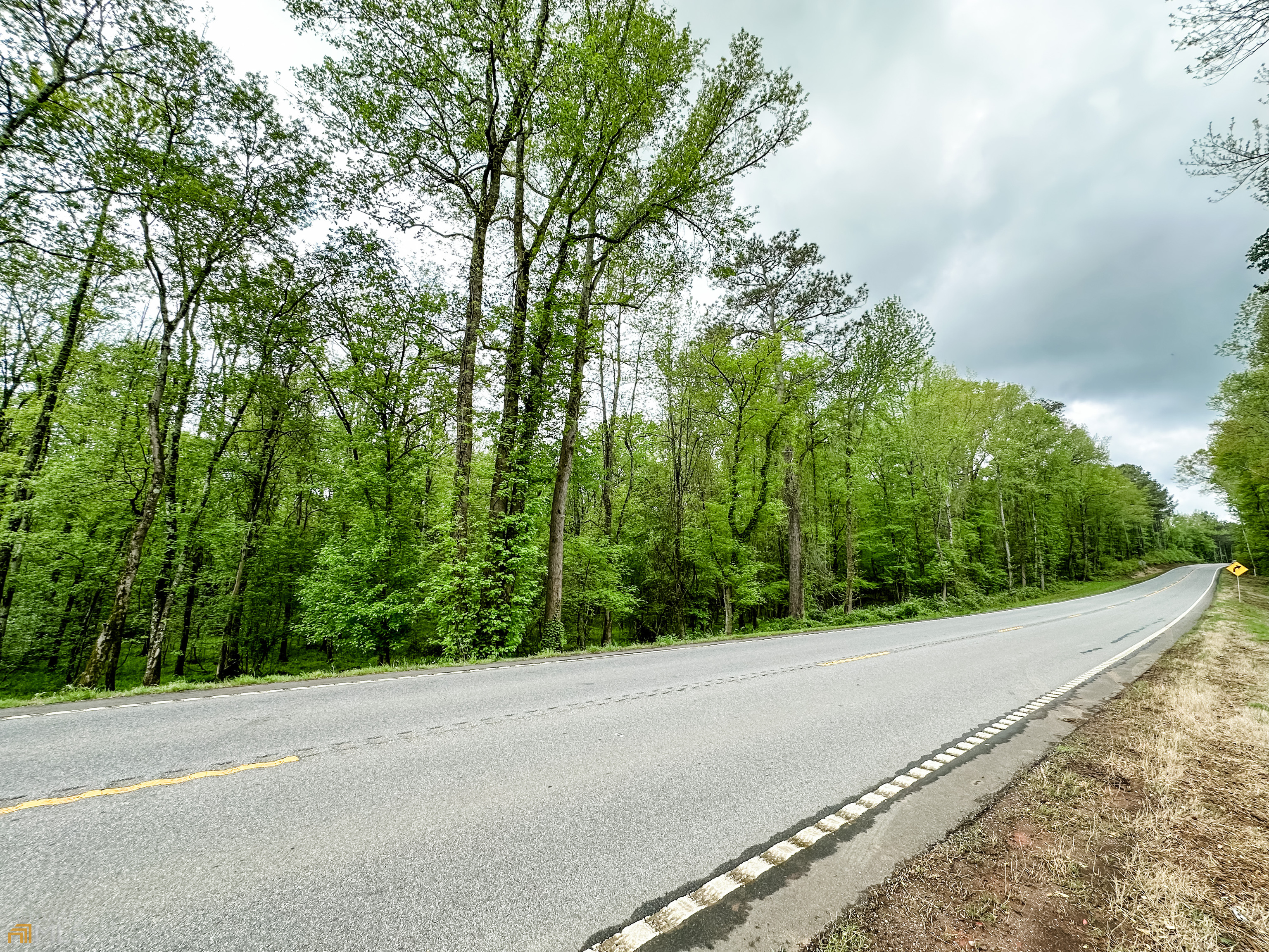 5 Washington Road, Unit 34 76 ACRES Lexington, GA 30648 - Photo 1 of 1 a view of a road with a trees