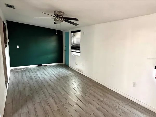 a view of a livingroom with wooden floor