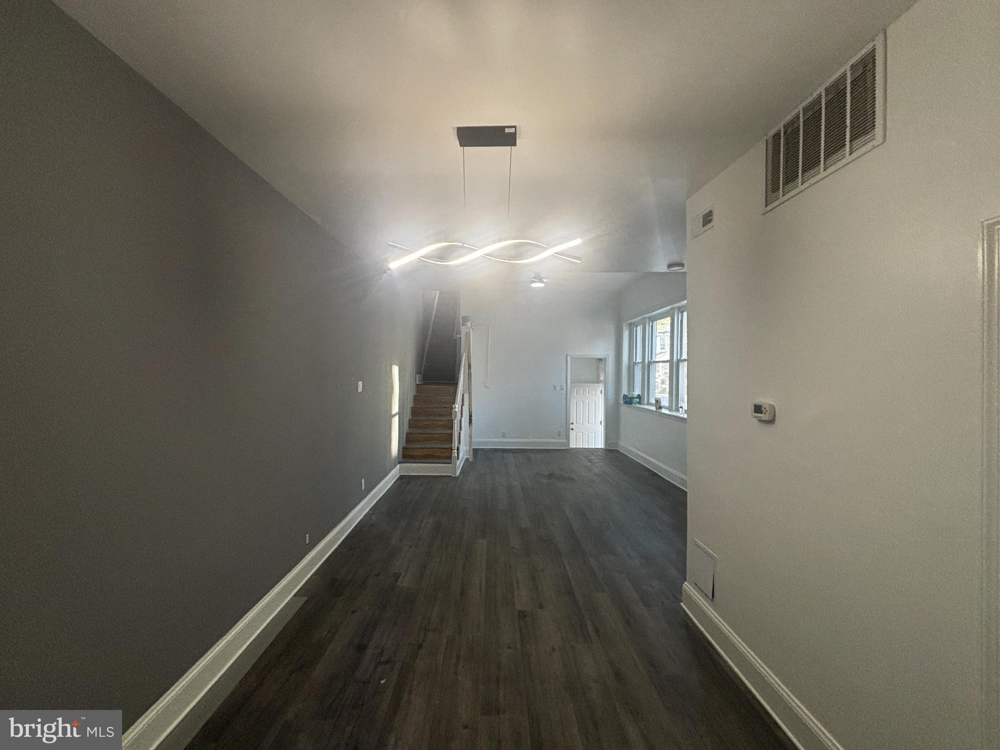 901 South 60th Street Philadelphia, PA 19143 - Photo 11 of 34 a view of a hallway with wooden floor