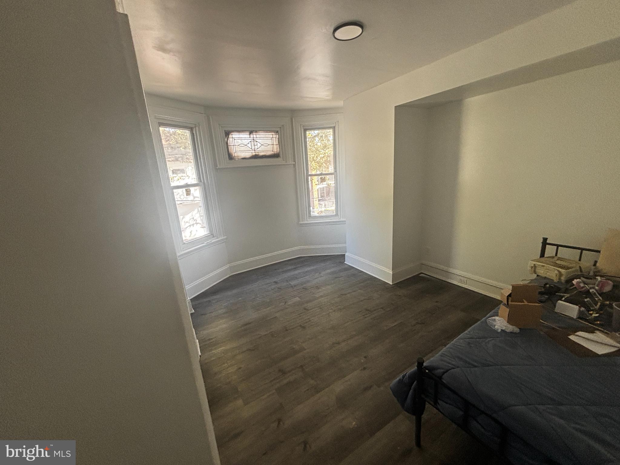 901 South 60th Street Philadelphia, PA 19143 - Photo 22 of 34 a view of a room that has a window and wooden floor
