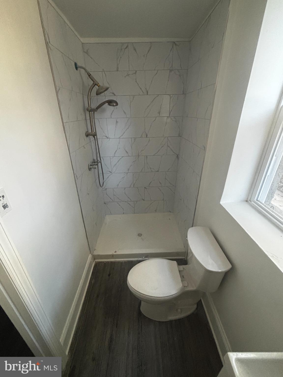 901 South 60th Street Philadelphia, PA 19143 - Photo 28 of 34 a bathroom with a shower and a toilet