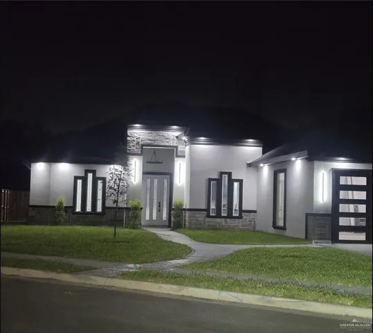 a large room with lots of green space and plants