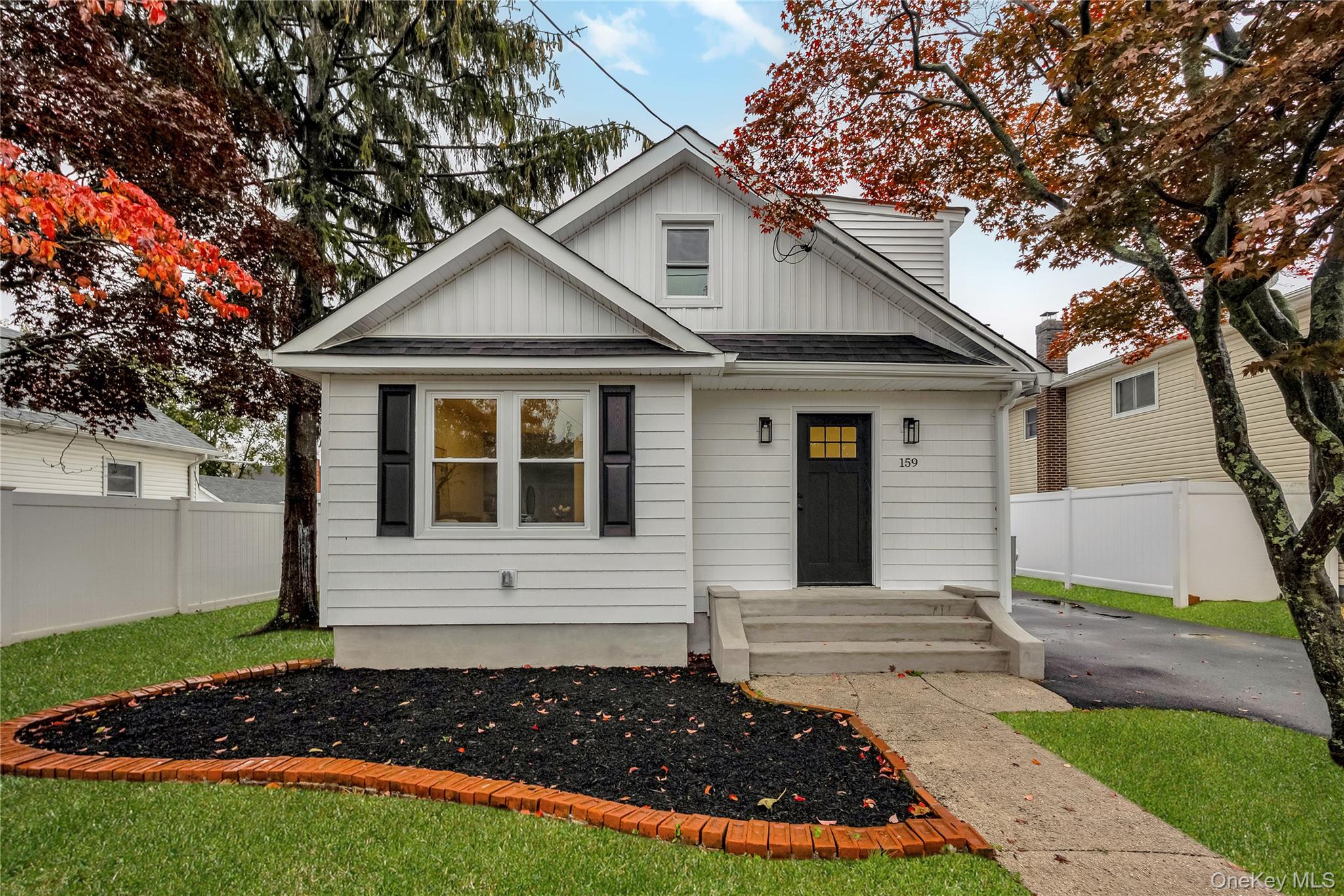159 35th Street Lindenhurst, NY 11757 - Photo 1 of 1 a front view of a house with a yard