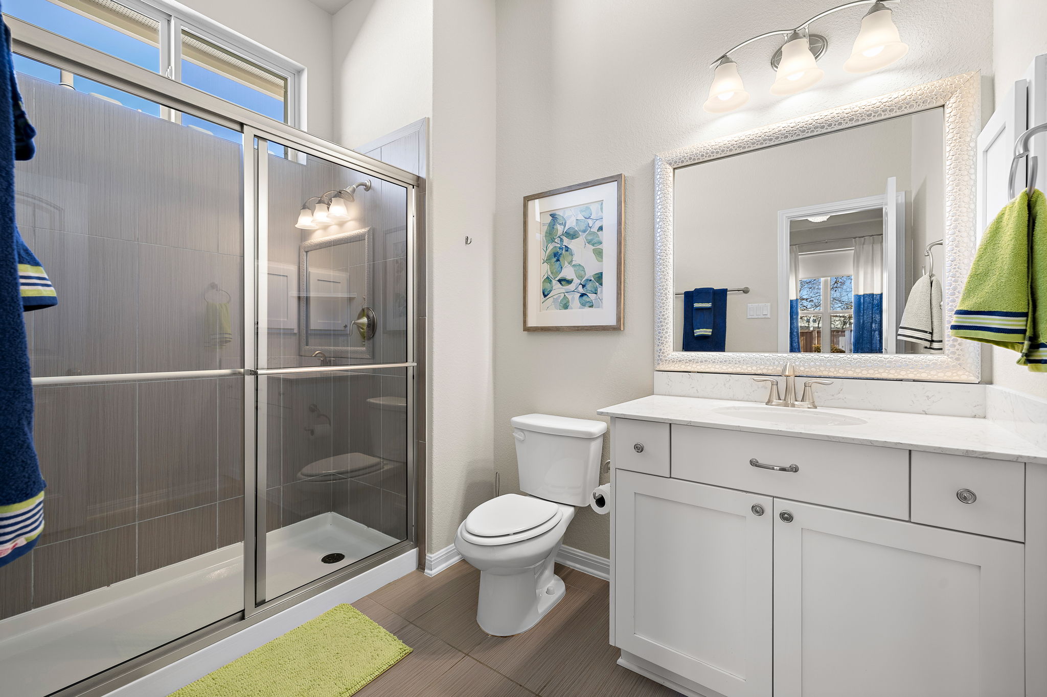 5016 Yucca Flower Lane Georgetown, TX 78626 - Photo 21 of 31 a bathroom with a toilet a sink and glass door