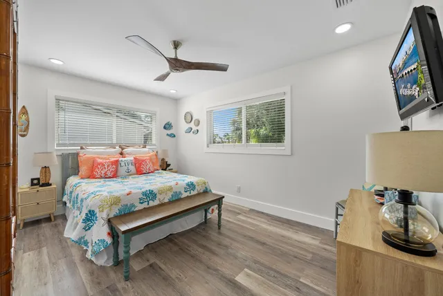 a bedroom with a bed and a table in it