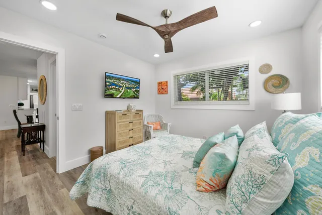 a bedroom with a bed and a table