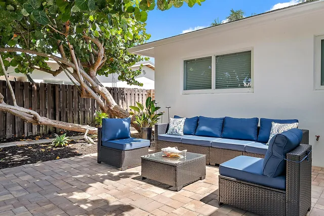 a view of backyard with outdoor seating