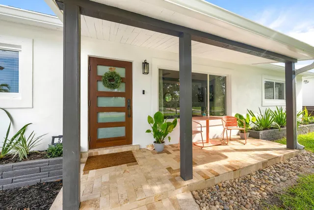 a view of a entryway door front of house