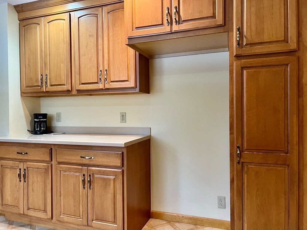 128 Depot Road Hatfield, MA 01038 - Photo 11 of 23 a kitchen with a refrigerator and cabinets