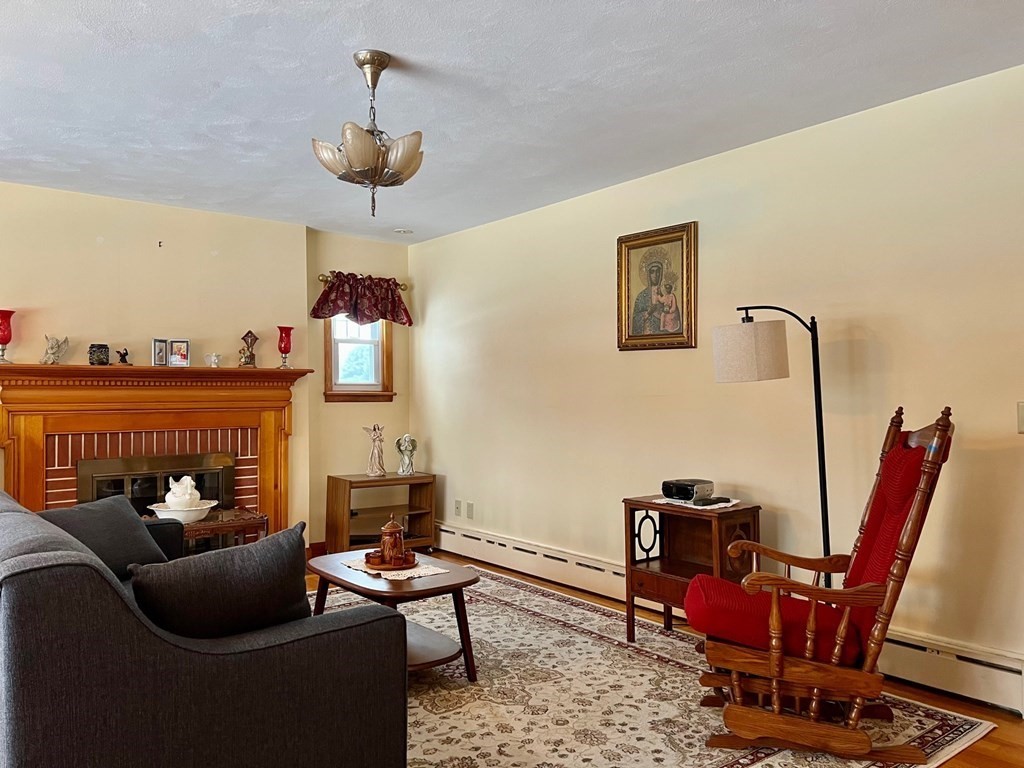 128 Depot Road Hatfield, MA 01038 - Photo 16 of 23 a living room with furniture a rug and a window